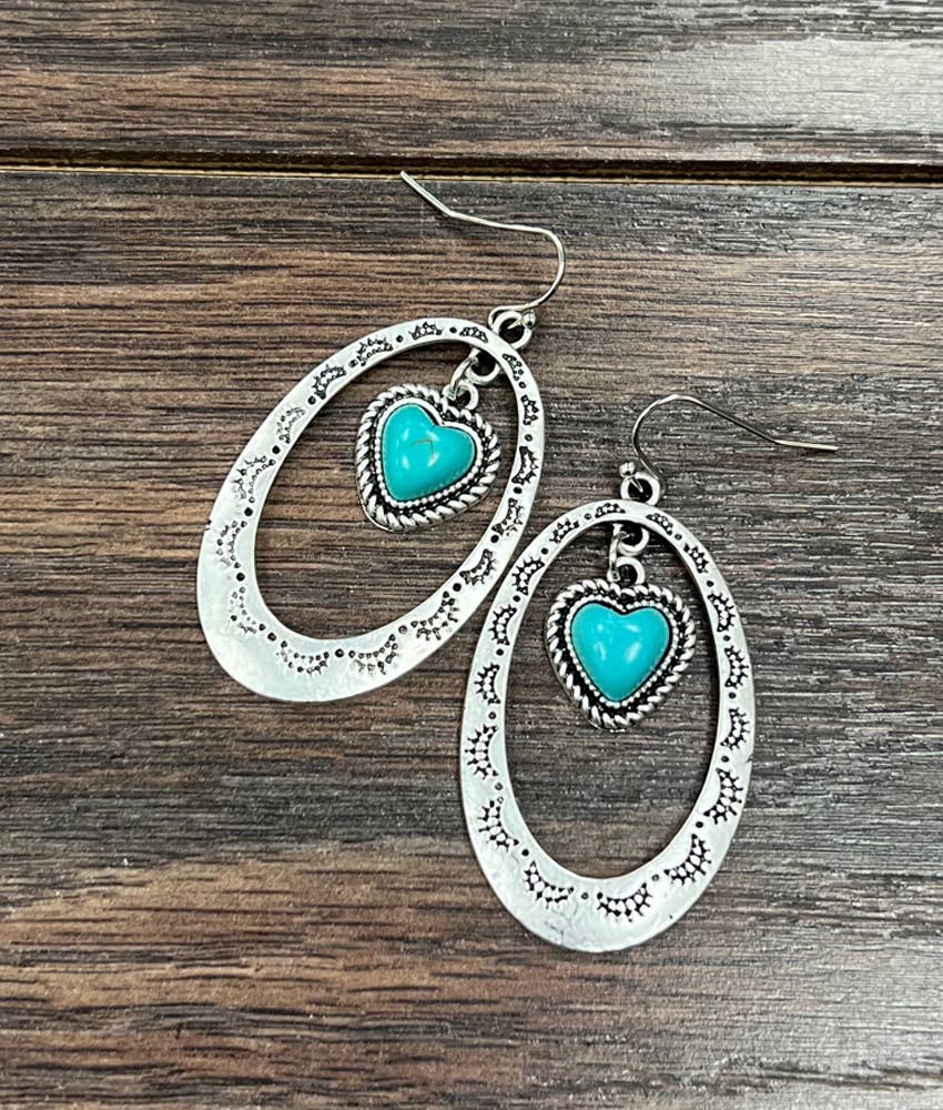 Stylish affordable ranch-style earrings featuring turquoise hearts and silver oval design