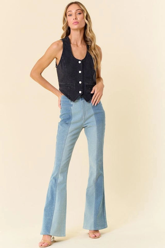 Stylish black denim vest women with button details paired with flared light blue jeans