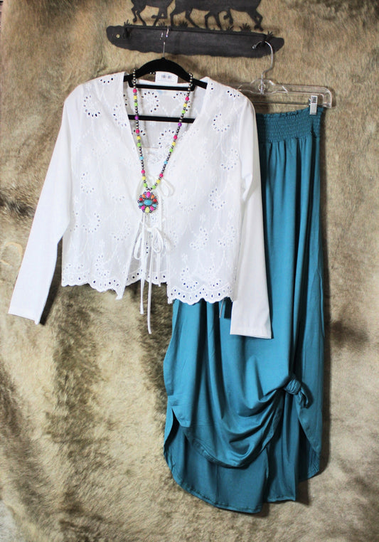 Boho embroidered tie front shirt paired with a teal skirt and colorful accessories for a trendy look