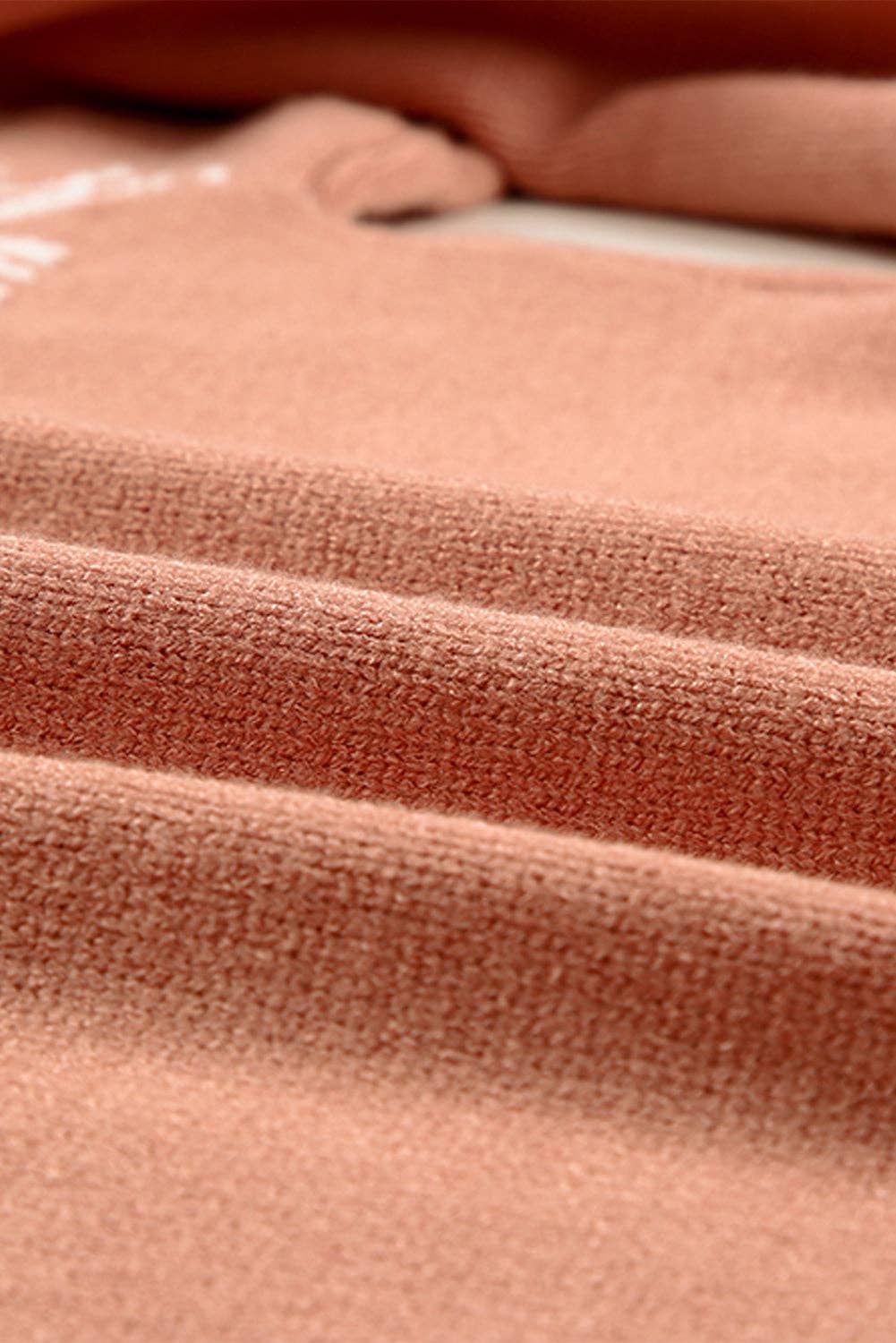 Close-up of a soft fabric texture of a PRETTY BASH boho western quarter zip apparel