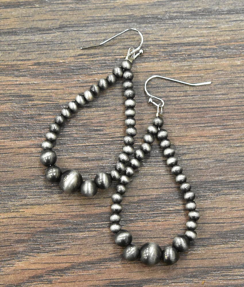 Handmade Navajo bead earrings with elegant teardrop design and silver-tone beads