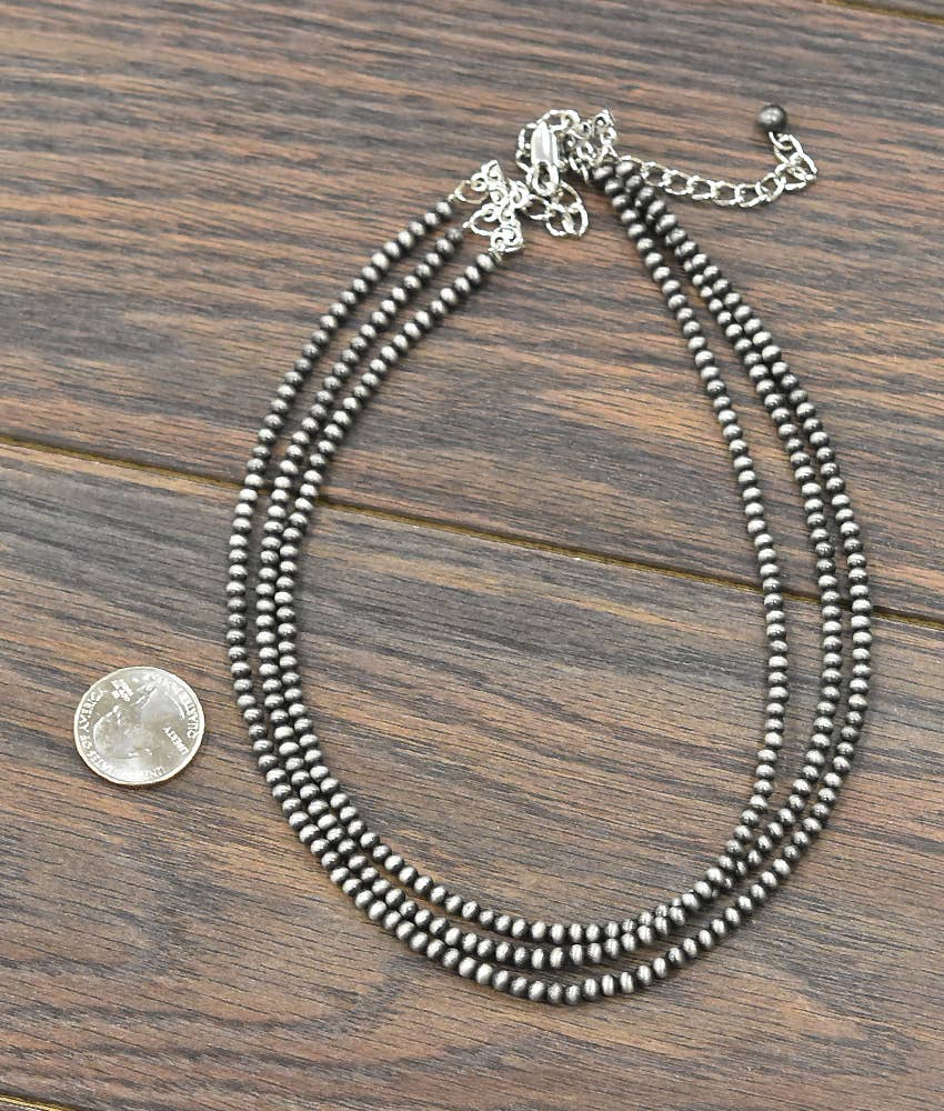 Handmade Navajo bead necklace featuring multiple strands and a stylish clasp, perfect for casual or formal wear