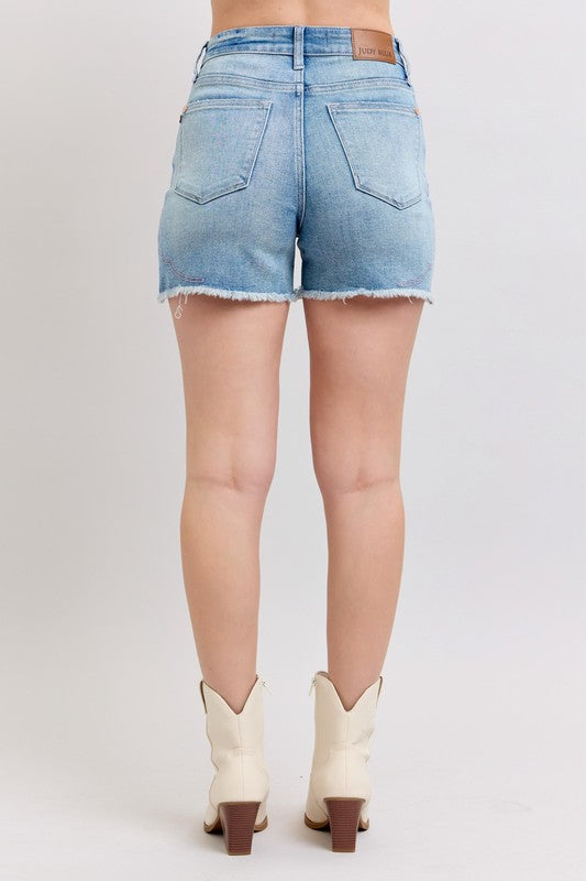 Back view of Judy Blue denim shorts featuring a distressed hem and fitted design for summer style
