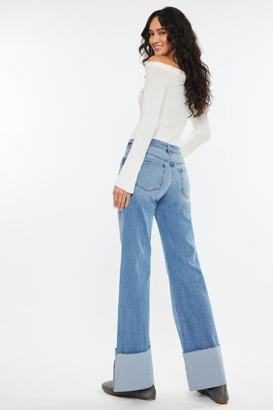 KanCan light wash cuff jeans with a relaxed fit, styled with a white off-shoulder top