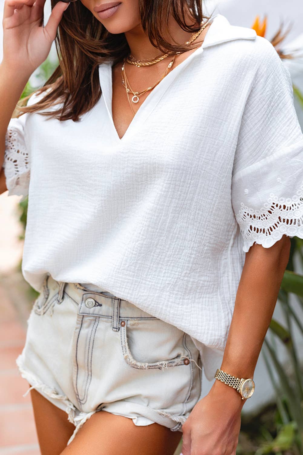Stylish lace splicing V neck top in white, perfect for casual summer outfits with shorts.