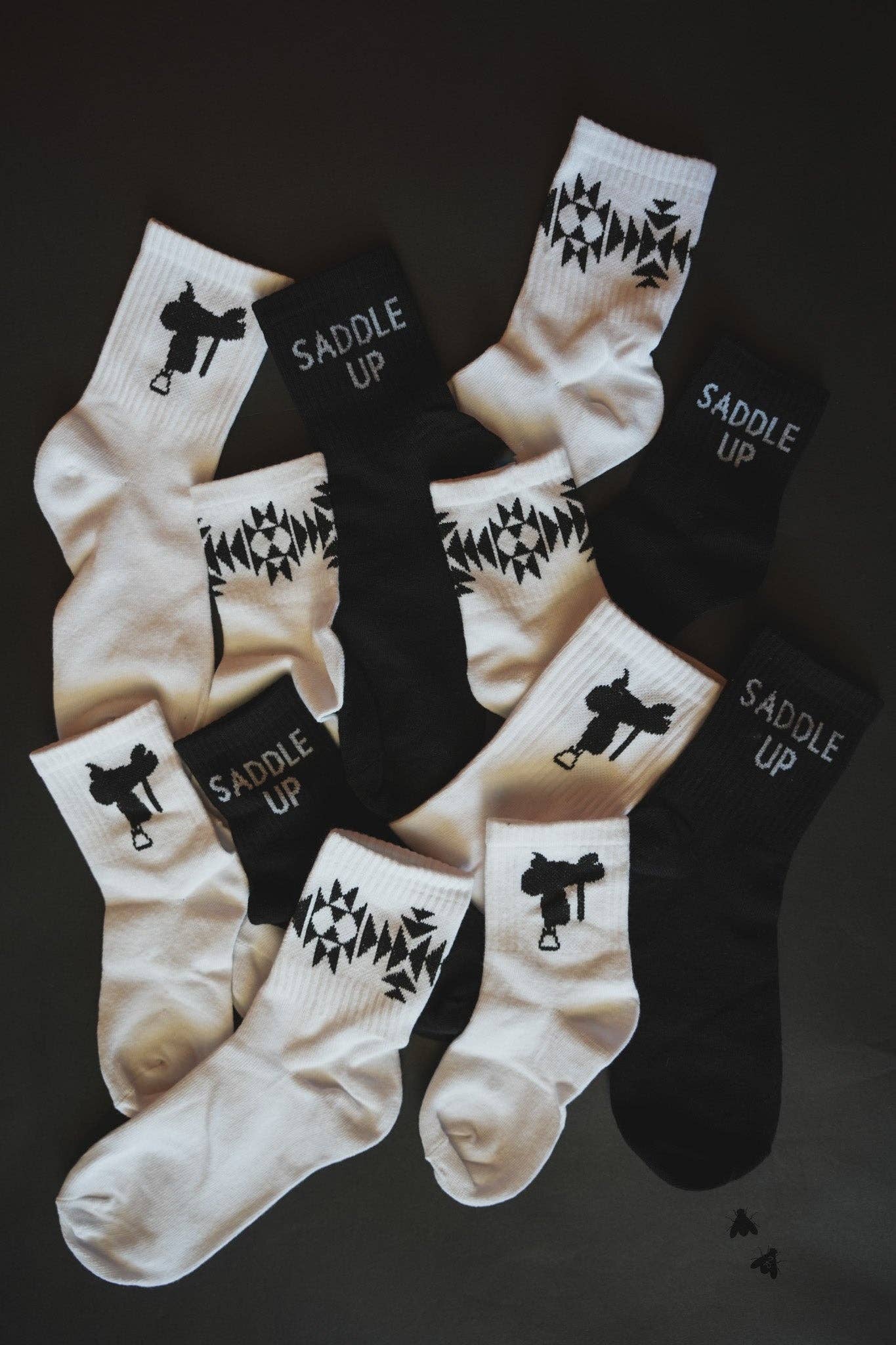 Sock Em Silly Saddle Mono Kids Socks in black and white with playful designs for fun casual wear