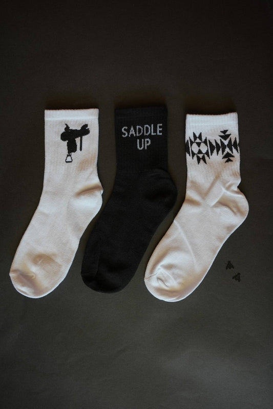 Sock Em Silly Saddle Mono Kids Socks featuring fun designs in black and white for playful children