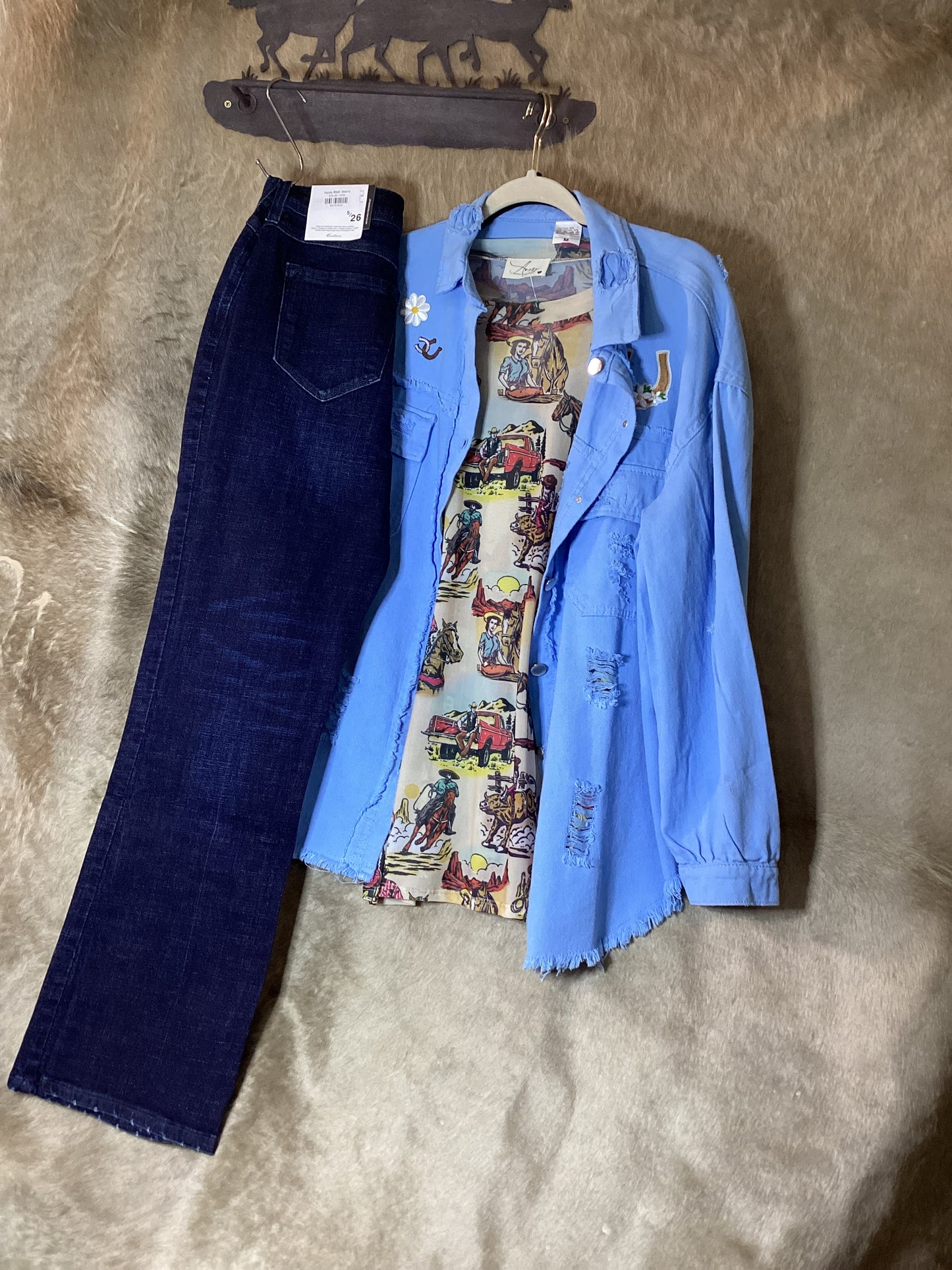 Rosa Clothing blue denim shirt paired with dark jeans and a colorful graphic tee for a stylish outfit