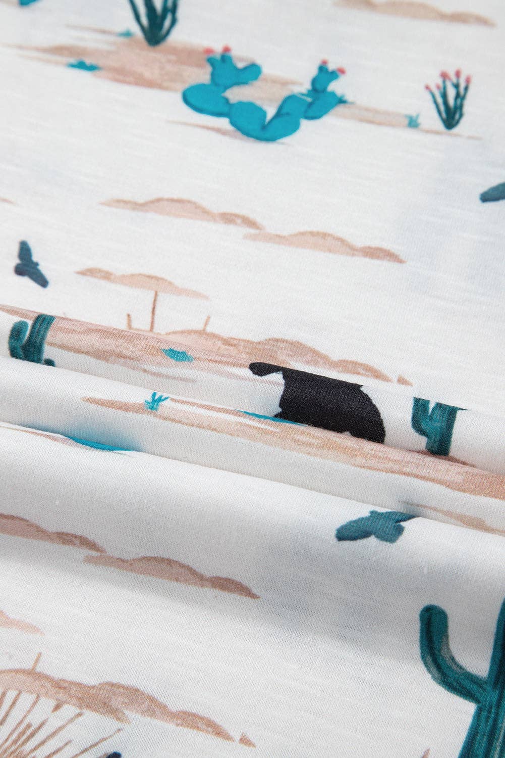 Soft fabric featuring a Western cactus top for women with colorful desert-themed prints