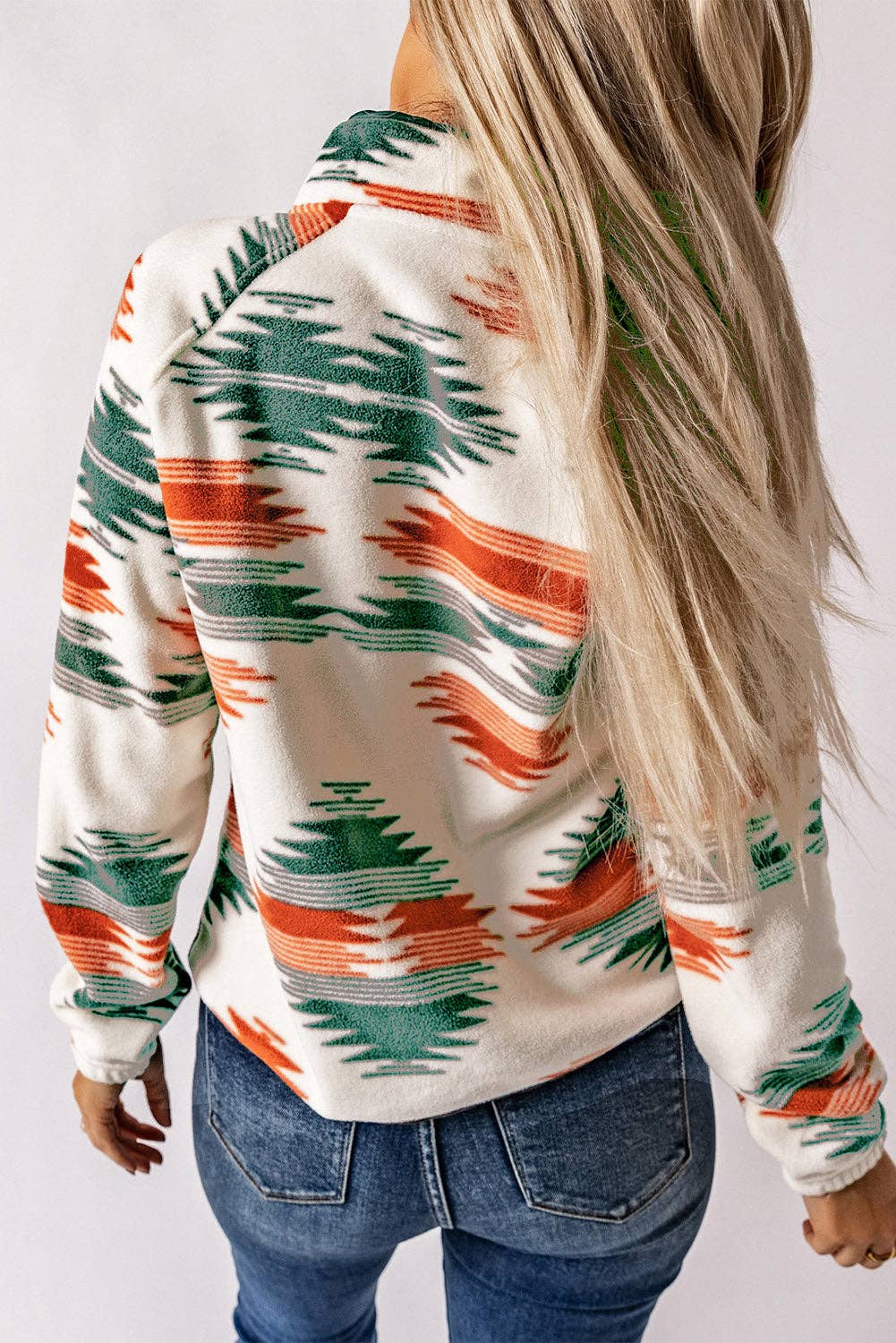 Back view of Women's Aztec Jacket featuring vibrant colors and a cozy design for stylish layering