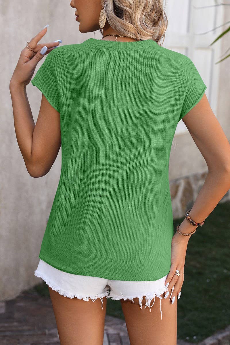 Back view of women's casual green knitwear styled with white denim shorts for a chic summer look