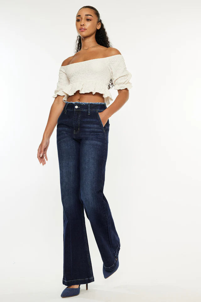 Stylish women's ranch style jeans in dark wash, perfect for a trendy casual look