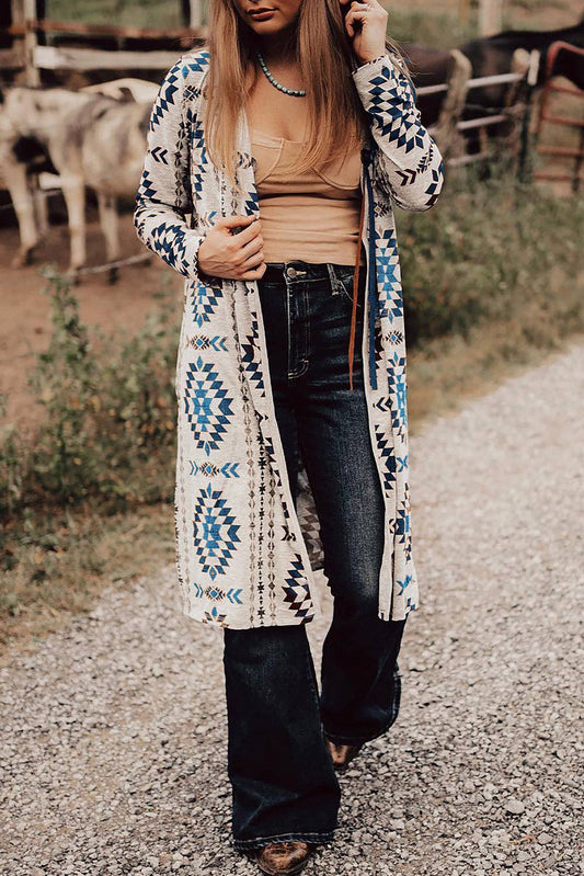 Blue Aztec cardigan women styled with a tan top and flared jeans for a trendy look