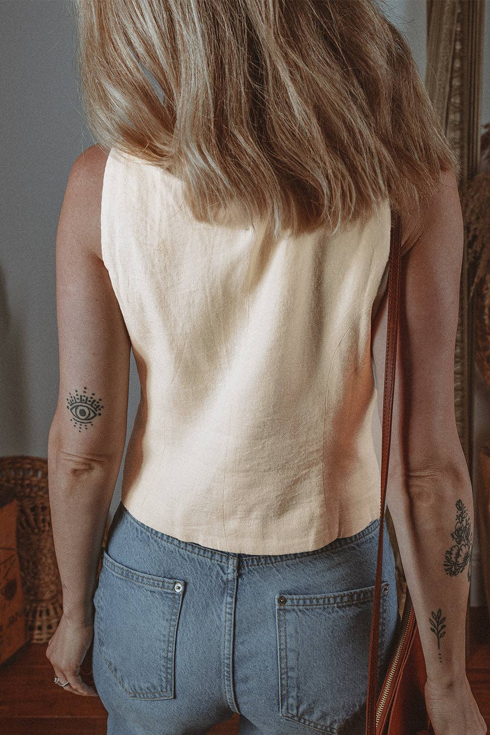 Cream button vest women made from lightweight fabric, perfect for casual summer outfits