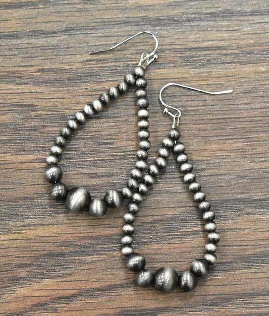 Handmade Navajo bead earrings with elegant teardrop design and silver-tone beads
