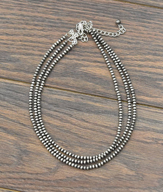Handmade Navajo bead necklace featuring multiple strands for a unique layered style