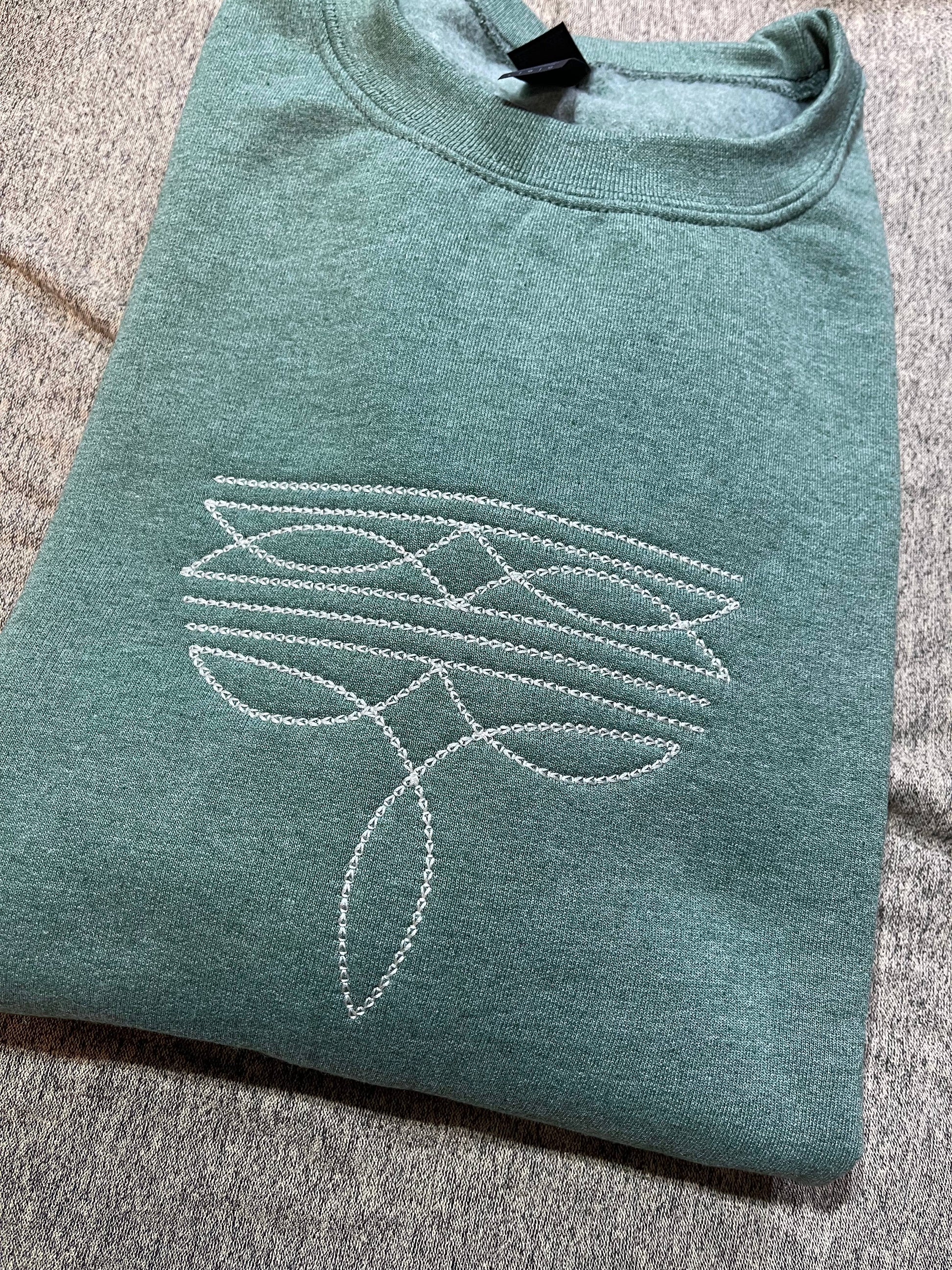 Basil & Burch ranch style boot stitch sweater in teal with intricate stitched design on the front