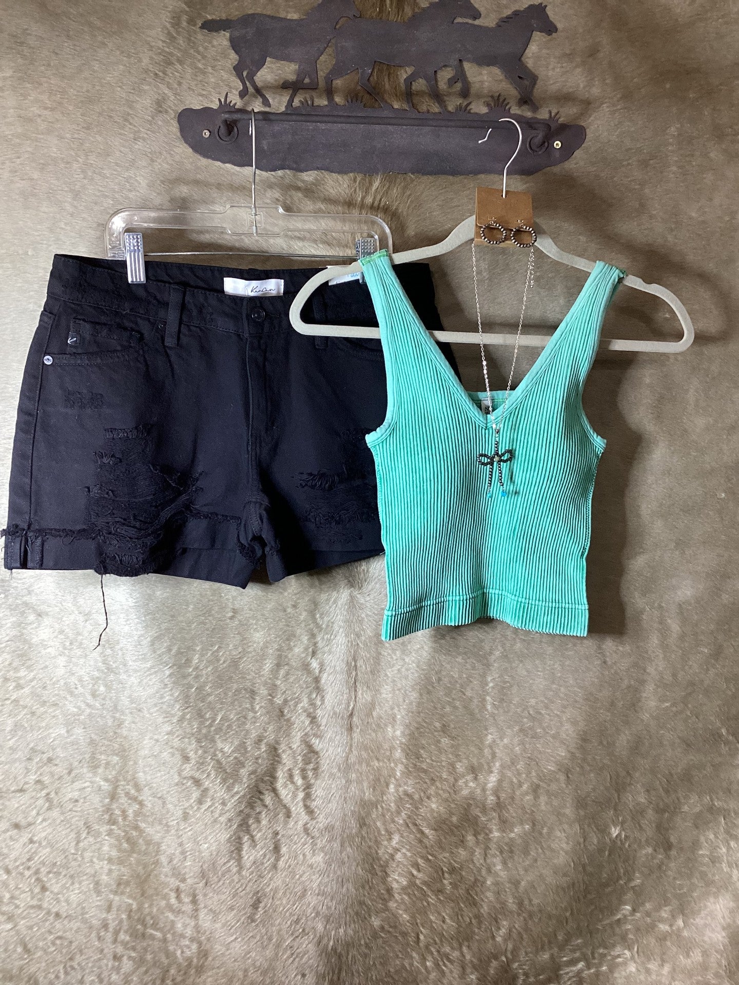Zenana women's ribbed tank top in mint green paired with black denim shorts on a hanger