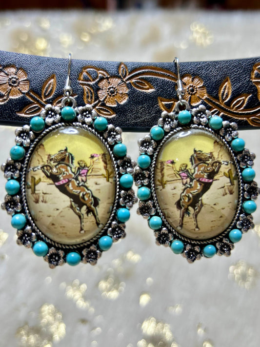 Vintage Western style jewelry earrings featuring a playful cowboy design with turquoise accents