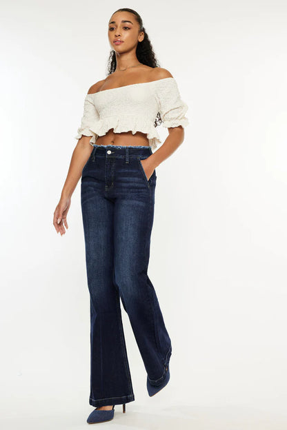 Stylish women's ranch style jeans in dark wash, perfect for a trendy casual look