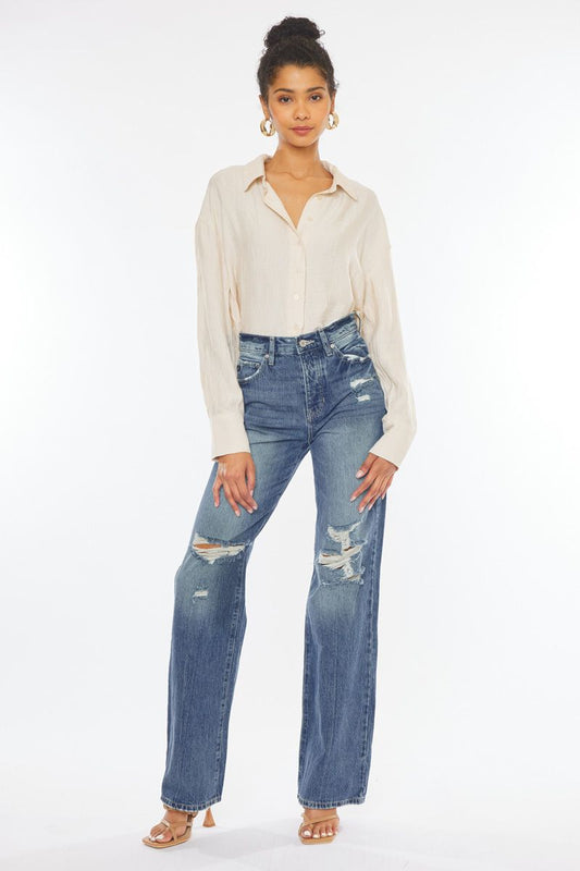 KanCan Montana boutique clothing featuring distressed high-waisted denim jeans styled with a chic blouse